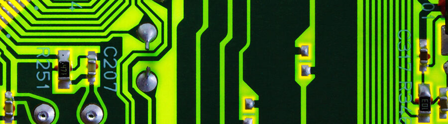 Close-up view of a microchip, highlighting intricate circuits and components on its surface