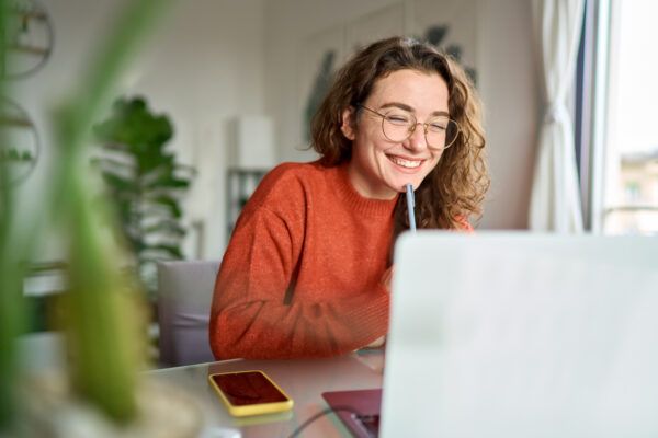 A happy female student showcases her engagement and focus in her studies.